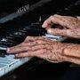 an old person playing the piano