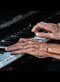 an old person playing the piano