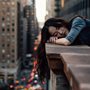 a depressed woman on a rooftop