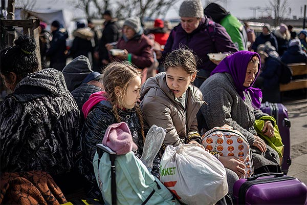 Ukrainian refugees waiting for trains at the Lviv Railway Station