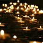 small votive candles on a tiered metal stand