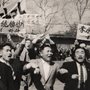 Black and white photo of Korean men protesting in the street