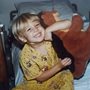 childhood photo of author's son Daniel with a stuffed animal