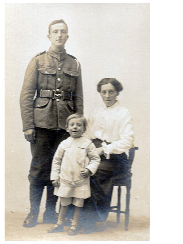 young man in a WWI British army uniform with his wife and son