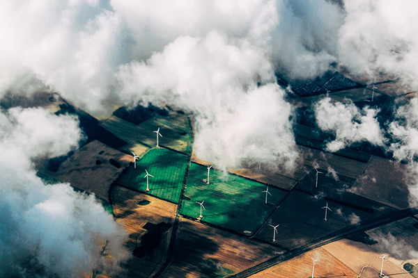 aerial view of windmills in farmland