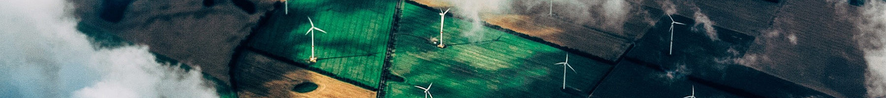 aerial view of windmills in farmland