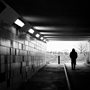 man walking through an underpass