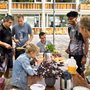 friends gathering for a meal at an outdoor table