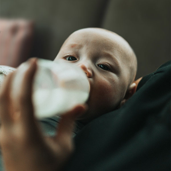 baby drinking from a bottle