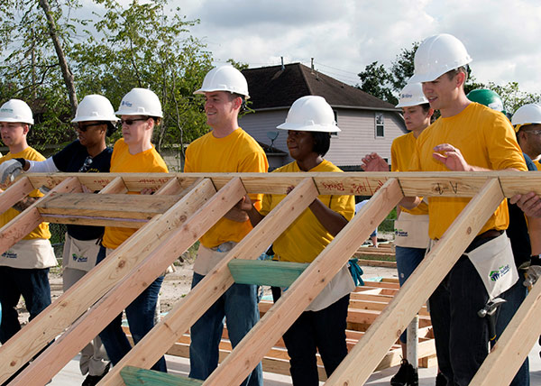 volunteers building a house
