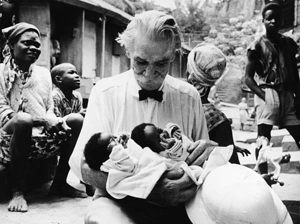 Albert Schweitzer holds two newborn babies at the hospital he founded