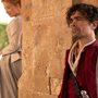 Cyrano standing behind pillar pining for Roxanne