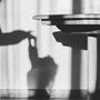 shadow of child and woman on a kitchen wall