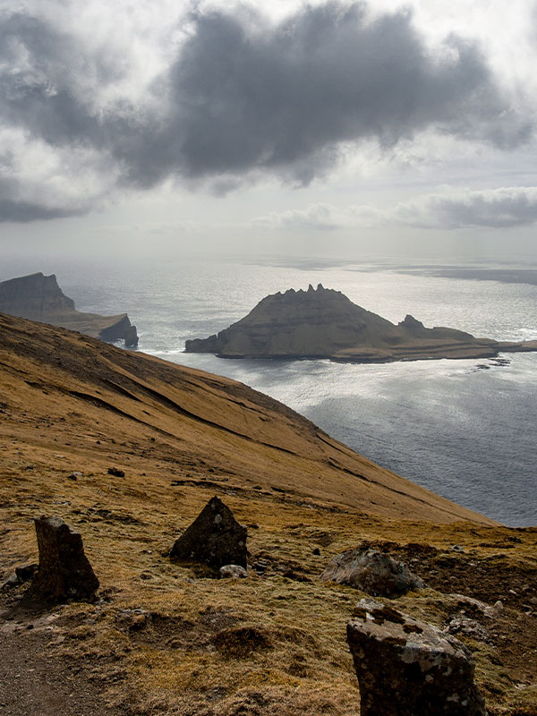 rocky coastline under a stormy sky