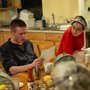 people reading poetry around a dinner table