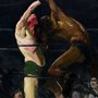 painting of two men in a boxing ring surrounded by a crowd