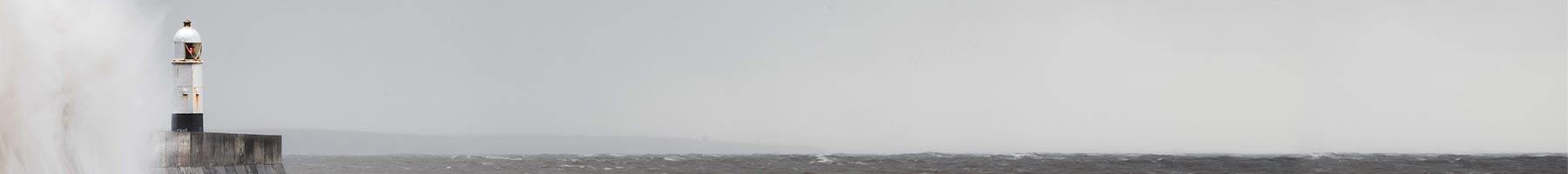 lighthouse on a misty coast