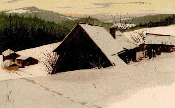 snow covered house in country landscape