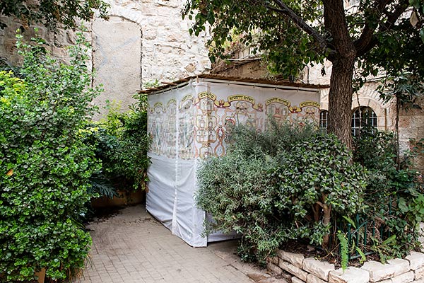 a sukkah in a garden in Jerusalem