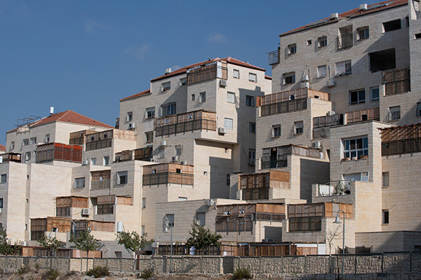 Sukkahs on the balconies of an apartment complex