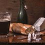 still life painting of bread, cheese, bottle and glass of beer