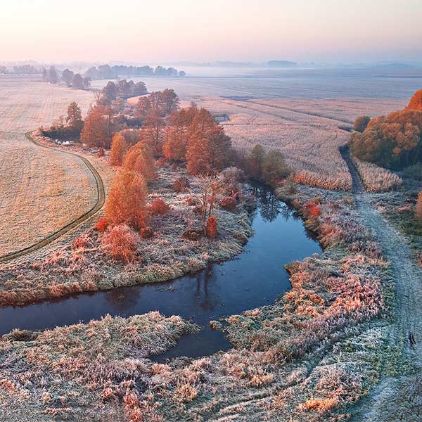 aerial view of farmland on a frosty morning