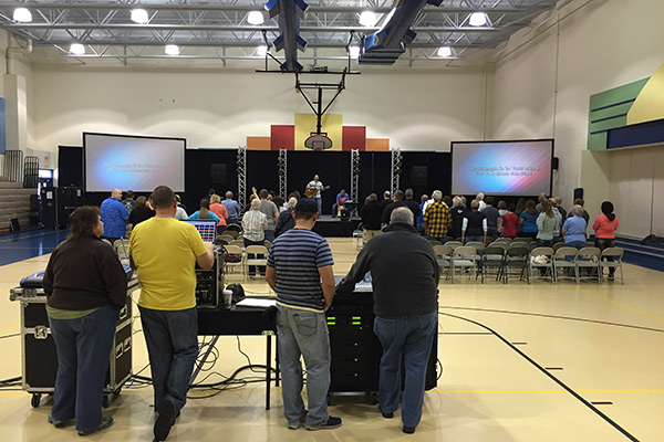 church service in an elementary school gym