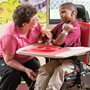 A therapist talking to a child in a Rifton Activity Chair