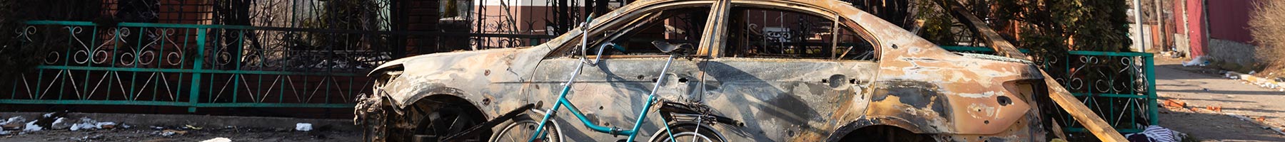 Damaged church and burned car in Irpin, Ukraine