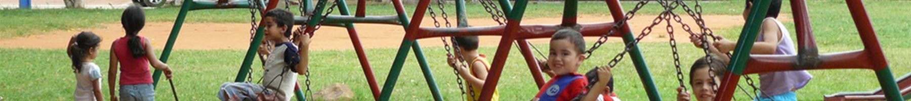 Paraguayan children on swings in park