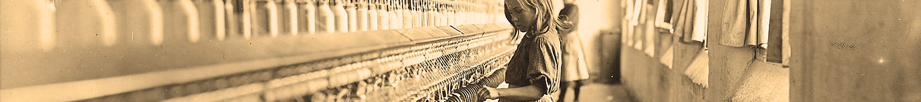 a young girl working in the Lancaster Cotton Mills