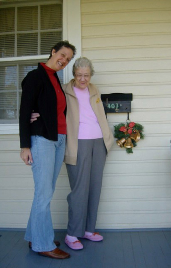 Teresa Nicholas with her mother on the porch of her house