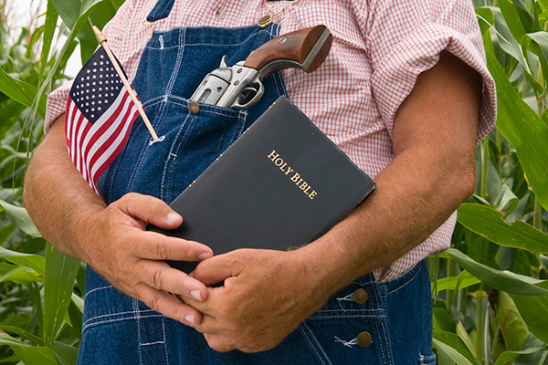 a farmer with a Bible, gun and American flag