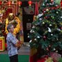 a man looking at a Christmas tree in Singapore