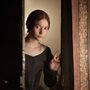 a woman opening a door