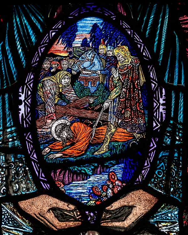 stained glass depicting Jesus falling for the third time