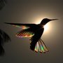 a silhouette of a hummingbird