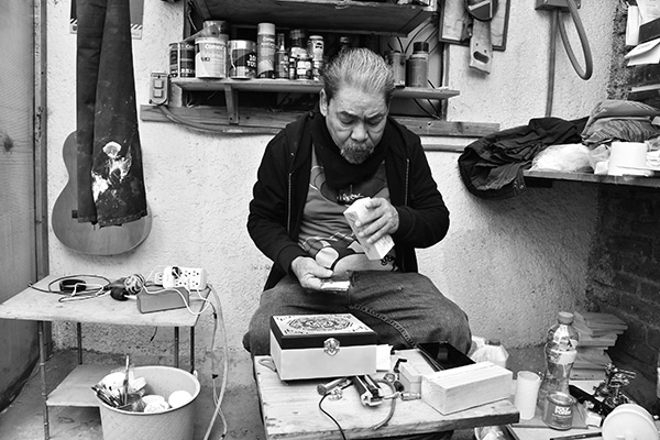 a man working in a carpentry shop