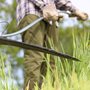 a man scything grass