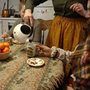 women having tea together at a kitchen table