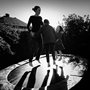 a mother and kids jumping on a trampoline