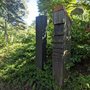 wooden headstones in a cemetery