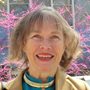 portrait of a woman by a flowering tree