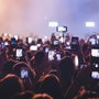people filming at a concert