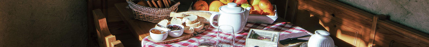 a table with plates of delicious breakfast food