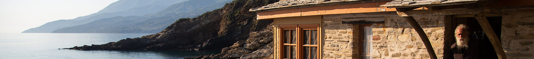 a man standing in the doorway of his home