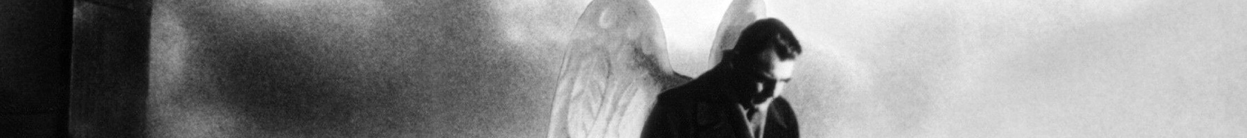 an angel standing above a city