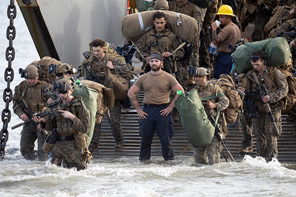 U.S. Marines disembark from a U.S. Navy Landing Craft Utility