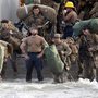 U.S. Marines disembark from a U.S. Navy Landing Craft Utility