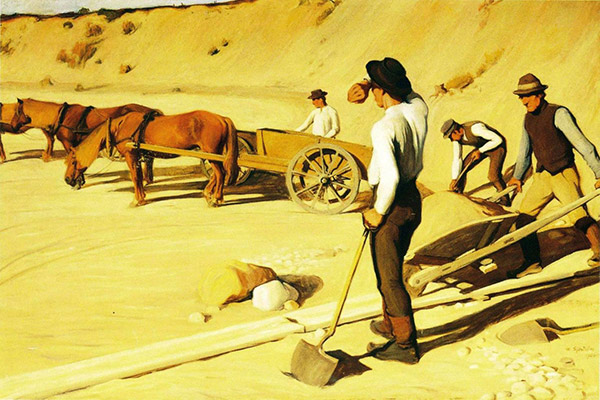 men working with horses in a sandpit